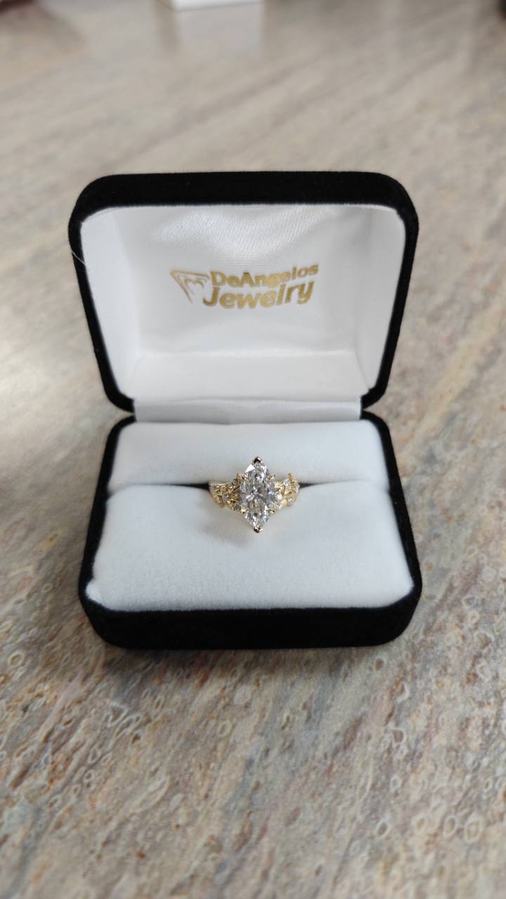Finished custom marquise diamond ring in a DeAngelos Jewelry presentation box